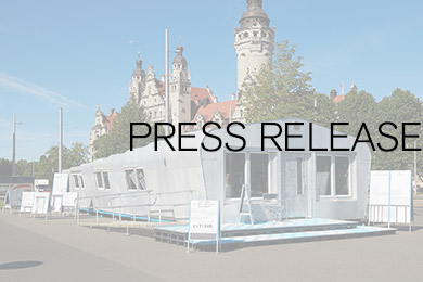 Historic "Raumerweiterungshalle"; superimposed on it the word Press Release