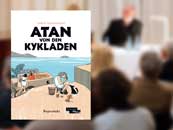 Cover of the book “Atan von den Kykladen“ (Atan of the Cyclades), in the background audience of an event