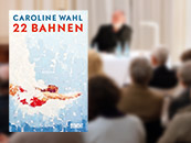Cover of the book "22 Bahnen", in the background audience of an event