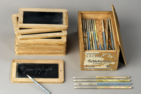 Slates and a selection of slate pencils