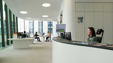 View inside the all-white music reading room with the curved service counter on the right. View inside the all-white music reading room with the curved service counter on the right.